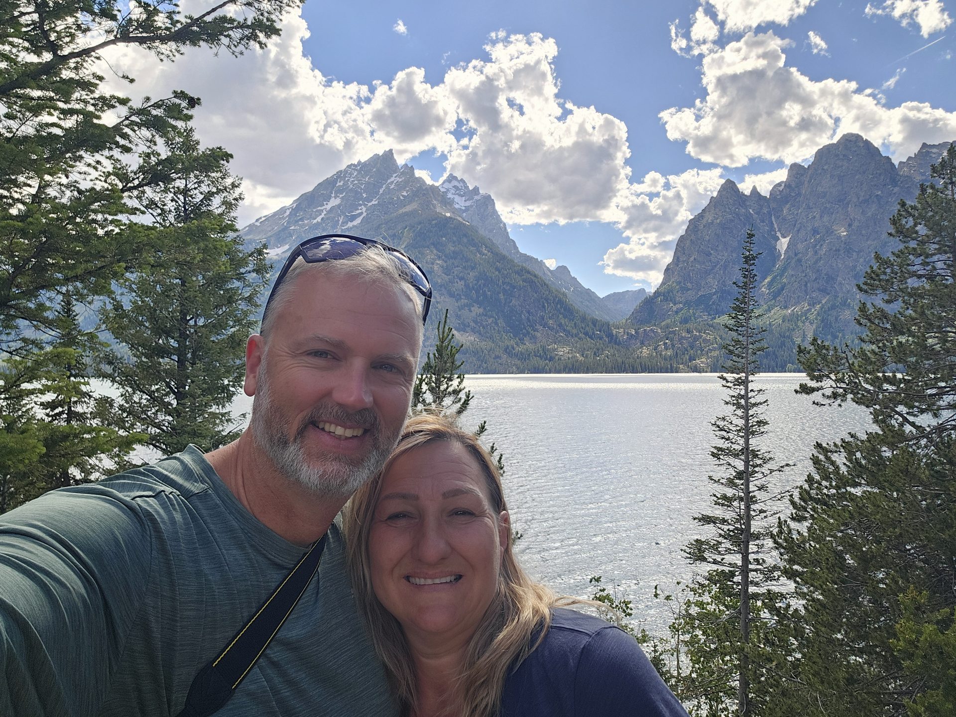 Gardner Kerin and Yoana together outdoors near a lake